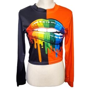 KAYLEE KOLLECTION | Women's orange and black lip bite graphic top. Size medium.